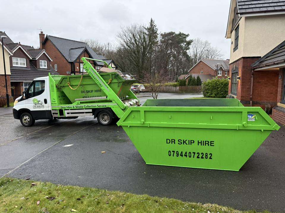 Green DR Waste collection vehicle serving a North West town