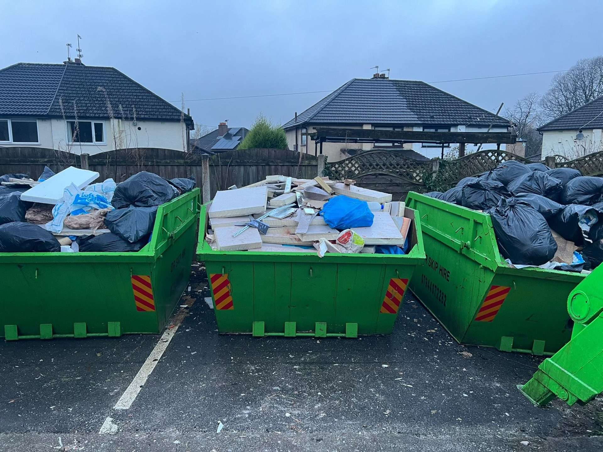 DR Waste team loading a truck
